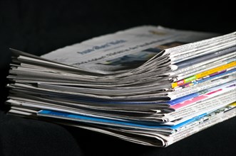 Piles of newspapers