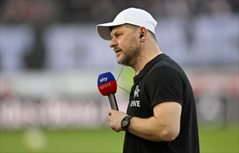 Coach Steffen Baumgart 1. FC Koeln KOE in interview with microphone Logo SKY