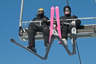 Family of skiers on a ski lift