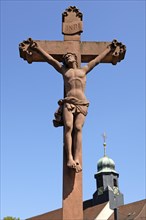 Christ Cross against blue sky at the back of St. Heinrich Church