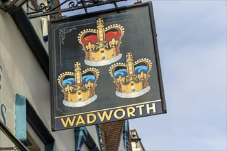 Pub sign for Wadworth brewery Three Crowns inn