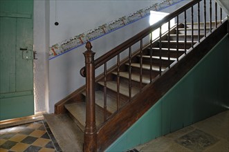 Stairs in the schoolhouse to the upper classroom