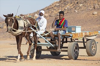 Egyptian men on a horse cart
