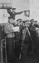 Sailors posing for a photo on their ship