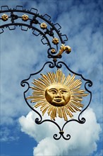 Nose sign of the Hotel Gasthof Sonne against cloudy sky