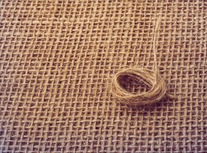 Roll of brown color linen string paper background