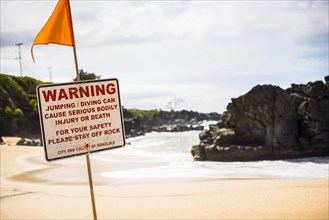 A Warning sign at the beach in the north shore of Oahu