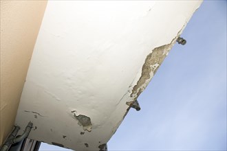 Underside of a balcony with damage due to moisture