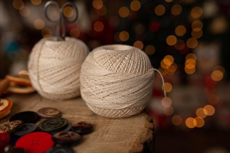 A Christmas scene with beautiful bokeh in the background and sewing tools. In studio