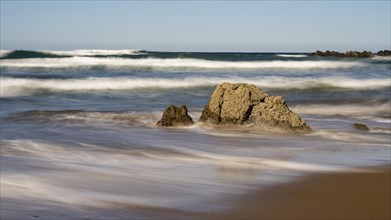 Waves lap stones