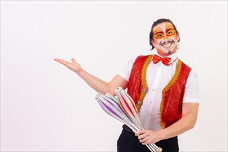 Portrait of a smiling juggler performing juggling with maces isolated on white background