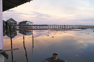 Evening atmosphere at the pier in the Muslim village of Batu Village