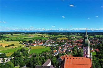 Aerial view of Andechs Monastery with the Alps in the background. Andechs