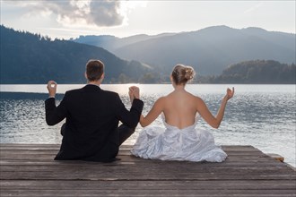 Bride and groom meditating
