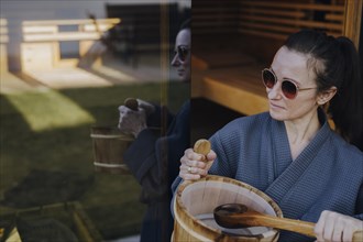 Woman taking a sauna