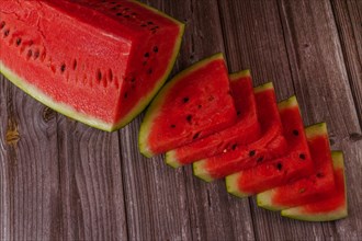 Close-up of fresh watermelon slices on a wooden table