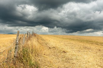 Countryside landscape under a threatening sky. Aubrac France