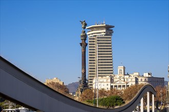 Columbus Monument at the end of Las Ramblas seen from Ramblas del Mar in Port Vell in Barcelona in Catalonia Spain