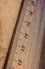 Part of ruler made of wood in close up view