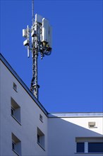 Antenna mast on flat roof