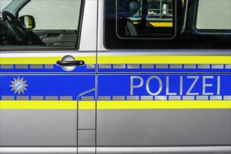Logo and lettering police on police car