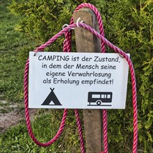Sign with pictogram tent