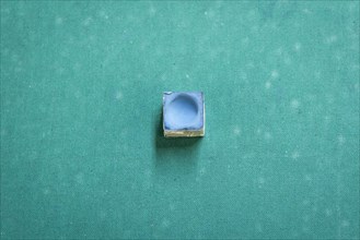 A snooker chalk on a pool table