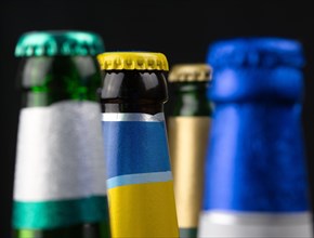Beverage bottles with crown caps in various colours