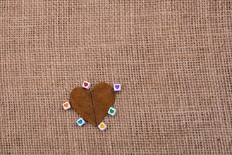 Colorful cubes with a heart on leaf on canvas