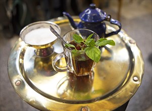 Traditional mint tea on a golden tray