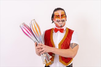 Smiling juggler juggling isolated on white background