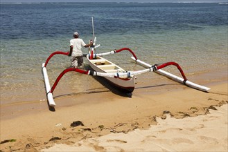 Fishing outriggers on the beach of Sanur