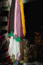 Empty mesh bags of various color at a market place