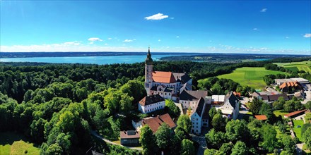 Aerial view of Andechs Monastery with the Lake Ammer lake in the background. Andechs