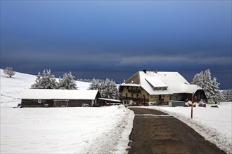 Homestead in snowy landscape