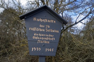 Wooden sign at the memorial and resting place for 76 Russian soldiers who died in captivity here during the Second World War