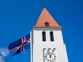 Church steeple and flag of Iceland