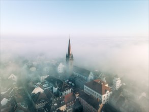 Swathes of fog drift over the old town of Radolfzell on Lake Constance