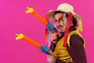 Juggler with white facial makeup on a pink background