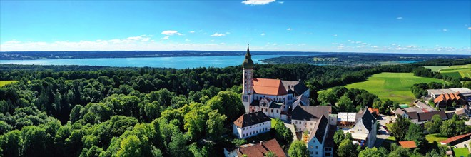 Aerial view of Andechs Monastery with the Lake Ammer lake in the background. Andechs