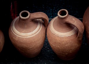 Ancient metal jug in oriental style in view