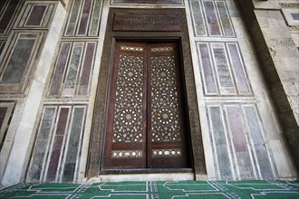 Wooden gate in the prayer room of the mosque