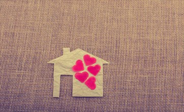 Model house and a heart shape beside it