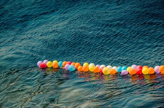 Balloon on a string on water for shooting game