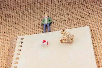 Figurine notebook and model crown