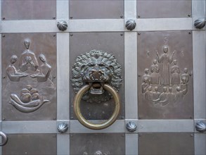 Door knocker and biblical motifs