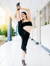 Woman dancer in heels doing yoga flexibilities