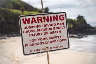 A Warning sign at the beach in the north shore of Oahu