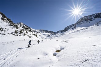 Group of ski tourers during the ascent in Schartlestal