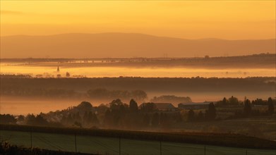Foggy sunrise over fields in Bohemian Moravia